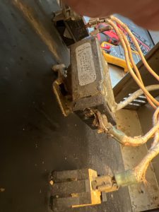 TechVill technician replacing the faulty thermostat on a Garland Air Deck commercial oven during service in Manchester Industrial, Calgary