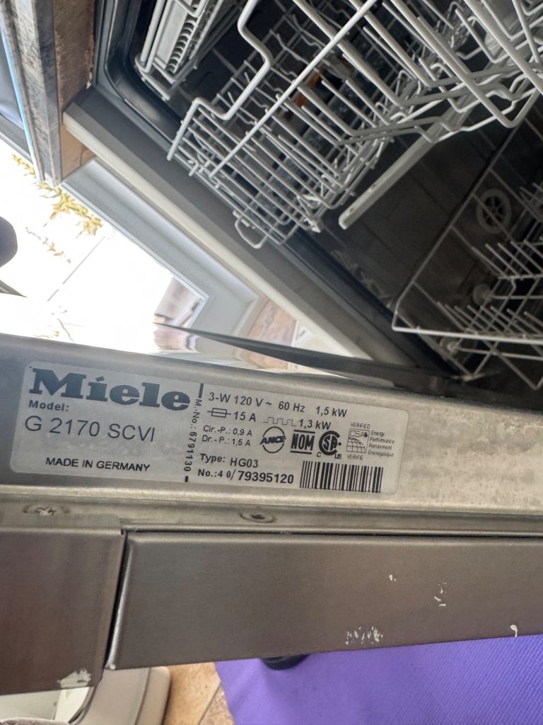 Miele G 2170 SCVI built-in dishwasher with door panel removed for gasket inspection in Arbour Lake, Calgary