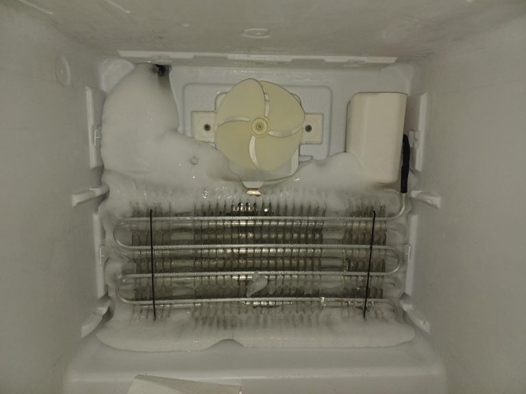 Evaporator coils cleared of ice on Blomberg built-in refrigerator after manual defrost service