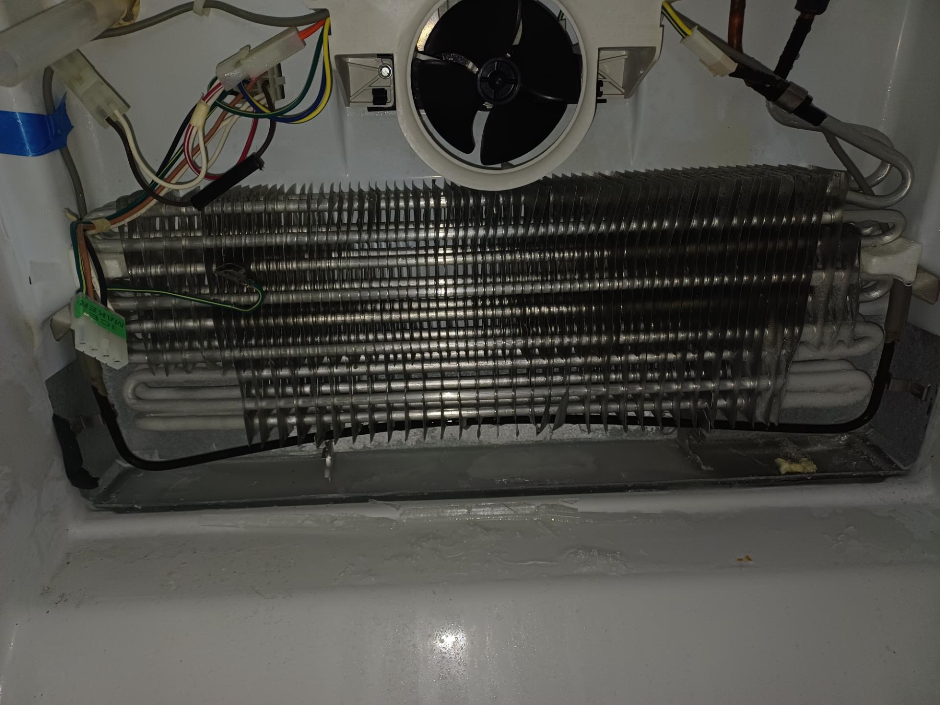 Aged copper dishwasher supply line and kinked refrigerator supply line identified during routine refrigerator service in Lincoln Park, Calgary