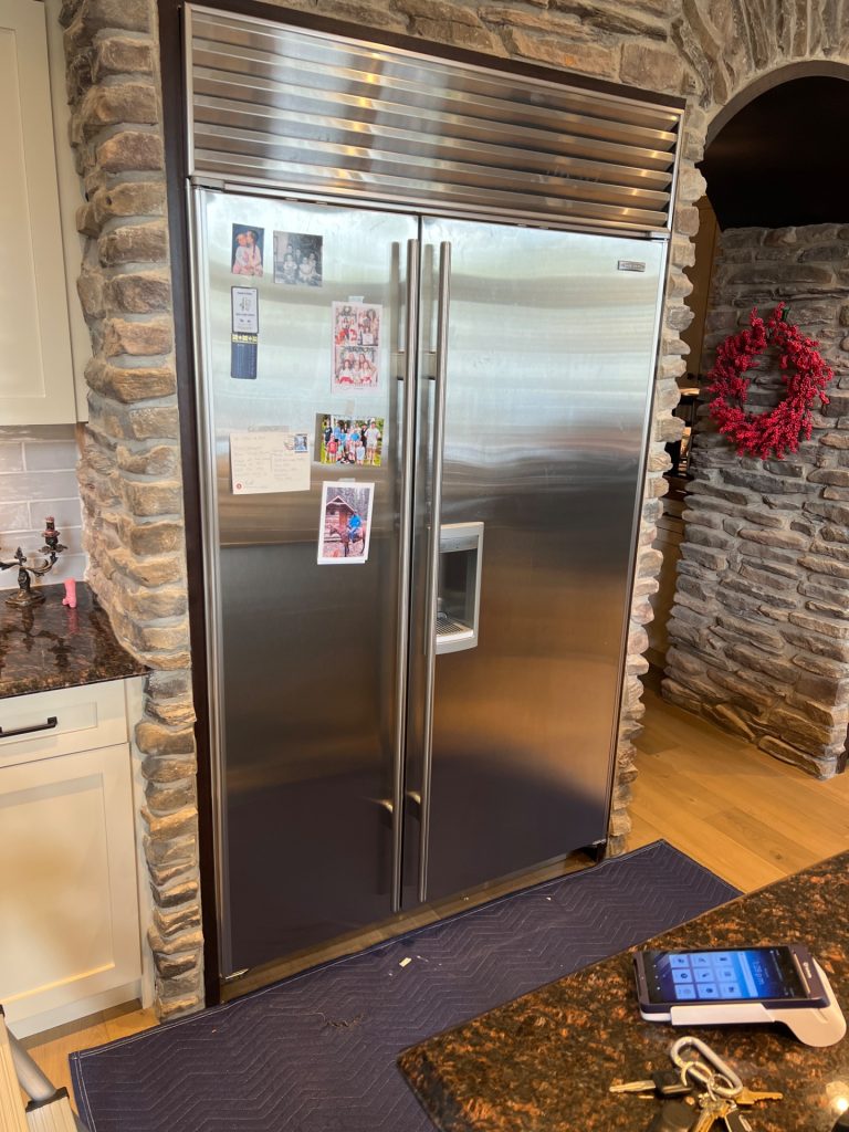 Sub-Zero 695/S3 built-in side-by-side refrigerator restored after coordinated sealed system rebuild in an Evergreen kitchen, Calgary