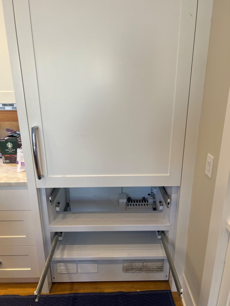 Sub-Zero 736TCI-6 built-in refrigerator with custom panels and lower freezer drawers pulled open during sealed system diagnostic in a Mayfair kitchen, Calgary