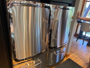 Heartland paired fridge and freezer retro-style refrigerator in Three Sisters Mountain Village, Canmore before service for not-cooling complaint