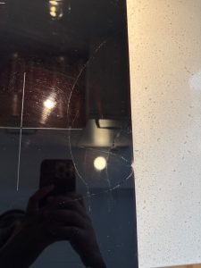 Close-up of the impact-pattern crack on the Bosch HIIP057C/05 induction glass-ceramic top