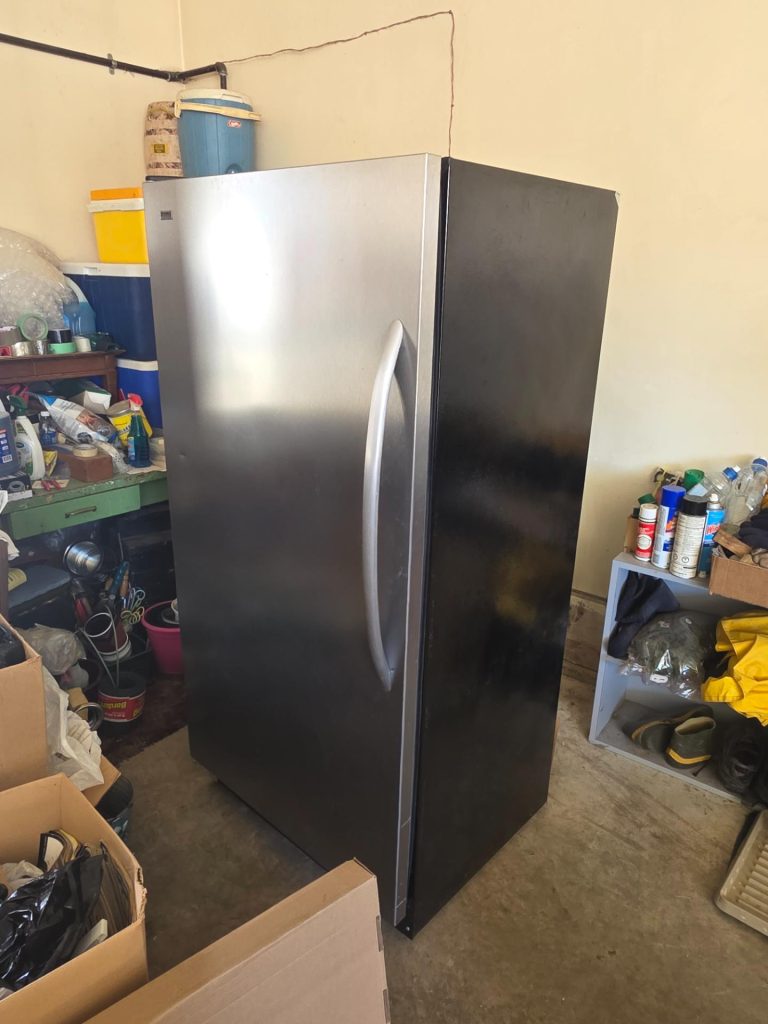 Worn door gasket on Kenmore refrigerator before service at rural Strathcona County address