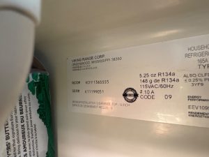 TechVill technician reseating the bail arm on a Viking VCFF1366 ice maker module during service in Caulfeild, West Vancouver