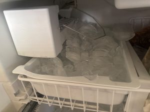 Bail arm pivot range tested through full travel on Viking ice maker after reattachment