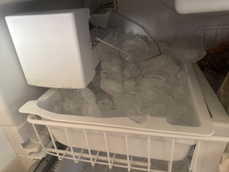 Bail arm pivot range tested through full travel on Viking ice maker after reattachment