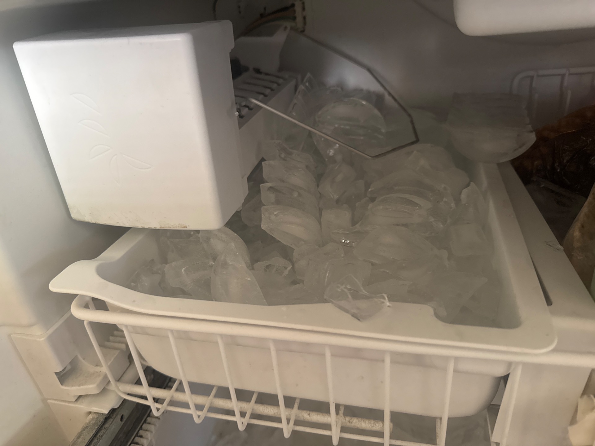 Bail arm pivot range tested through full travel on Viking ice maker after reattachment