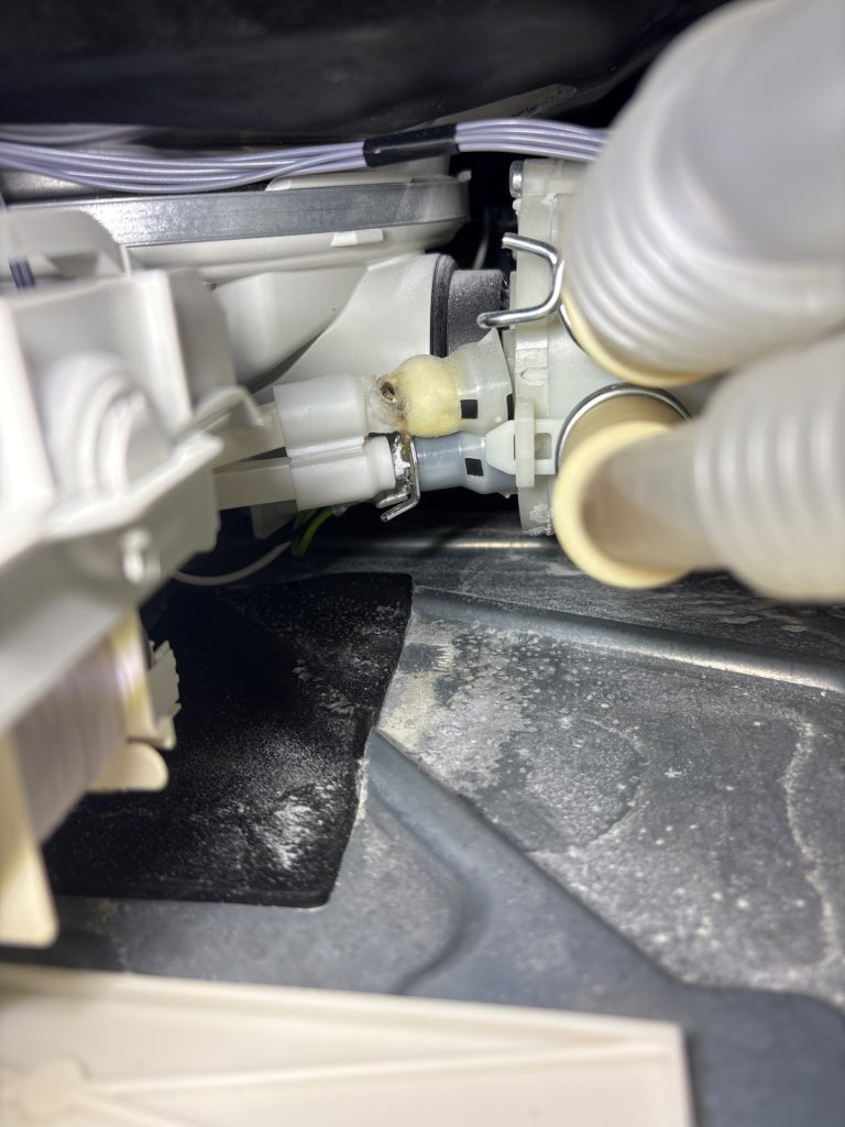 Melted power connector on a Miele dishwasher heating element found during electrical fault diagnosis near Black Diamond, Alberta