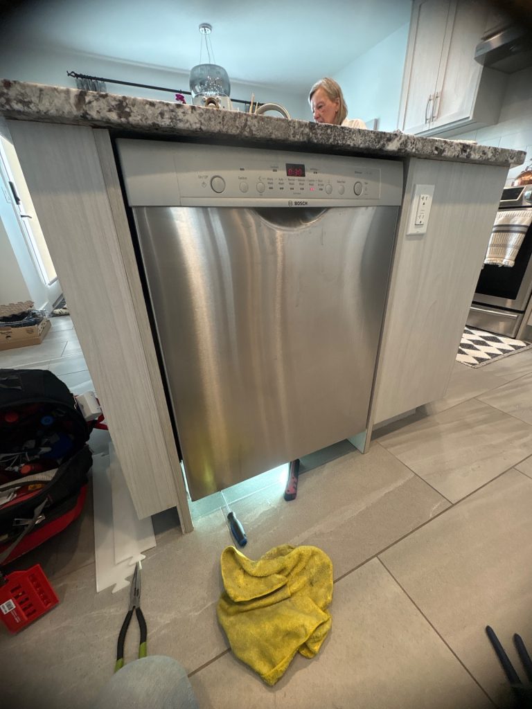 Bosch dishwasher water inlet valve location at the bottom-front-left of the SHE3ARF5UC unit in Somerset, SW Calgary