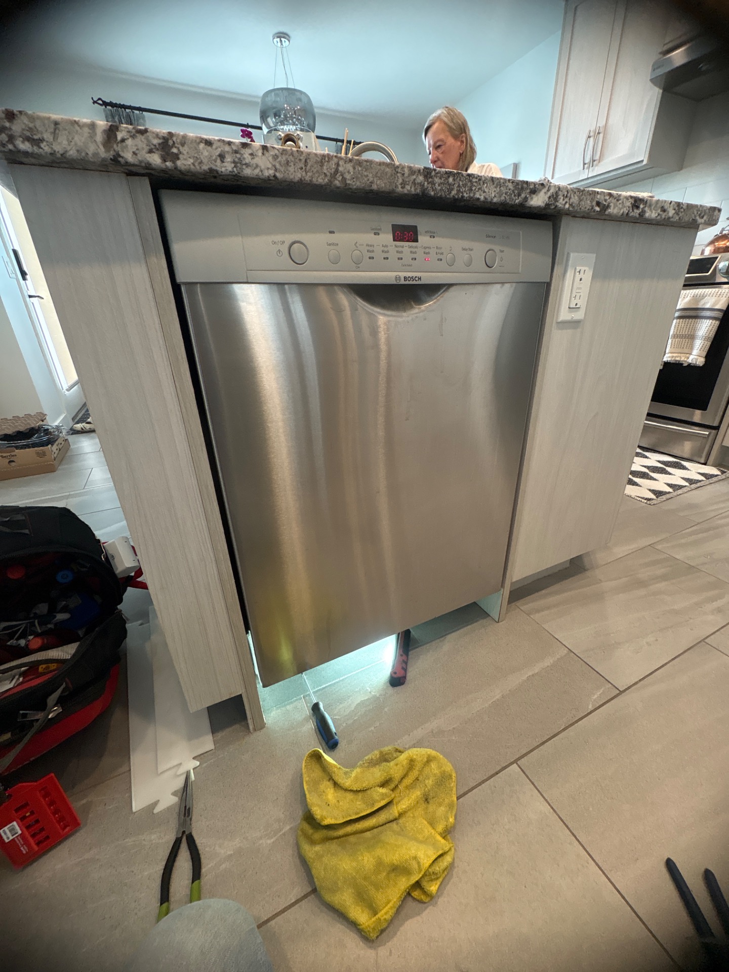 Bosch dishwasher water inlet valve location at the bottom-front-left of the SHE3ARF5UC unit in Somerset, SW Calgary