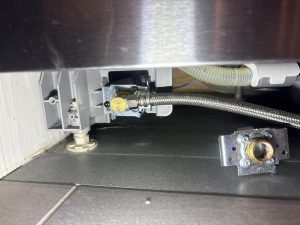OEM Bosch water inlet valve installed in the SHE3ARF5UC dishwasher after the diagnostic and replacement 