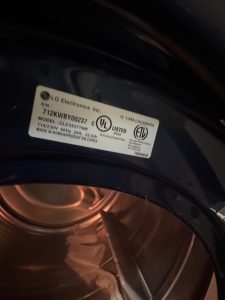 Close-up of the heating element coil on the LG DLEX8377, showing the resistive coil that has degraded over years of use