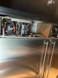 Sealed-system recharge complete on the Marvel M72CSS-WS, with the freezer returning to normal cooling operation after the rebuild