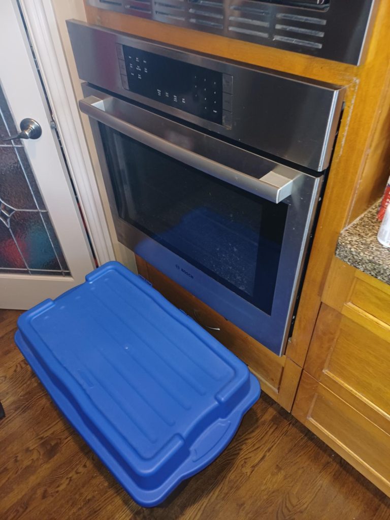 Bosch HBL8451 built-in wall oven in kitchen cabinetry before thermal cascade repair in Coach Hill, Calgary