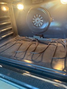 Burnt-out bake element inside a Frigidaire electric range oven cavity in Scenic Acres, Calgary