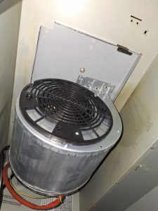 KitchenAid 600 CFM range hood blower assembly removed for motor and capacitor replacement in SE Calgary