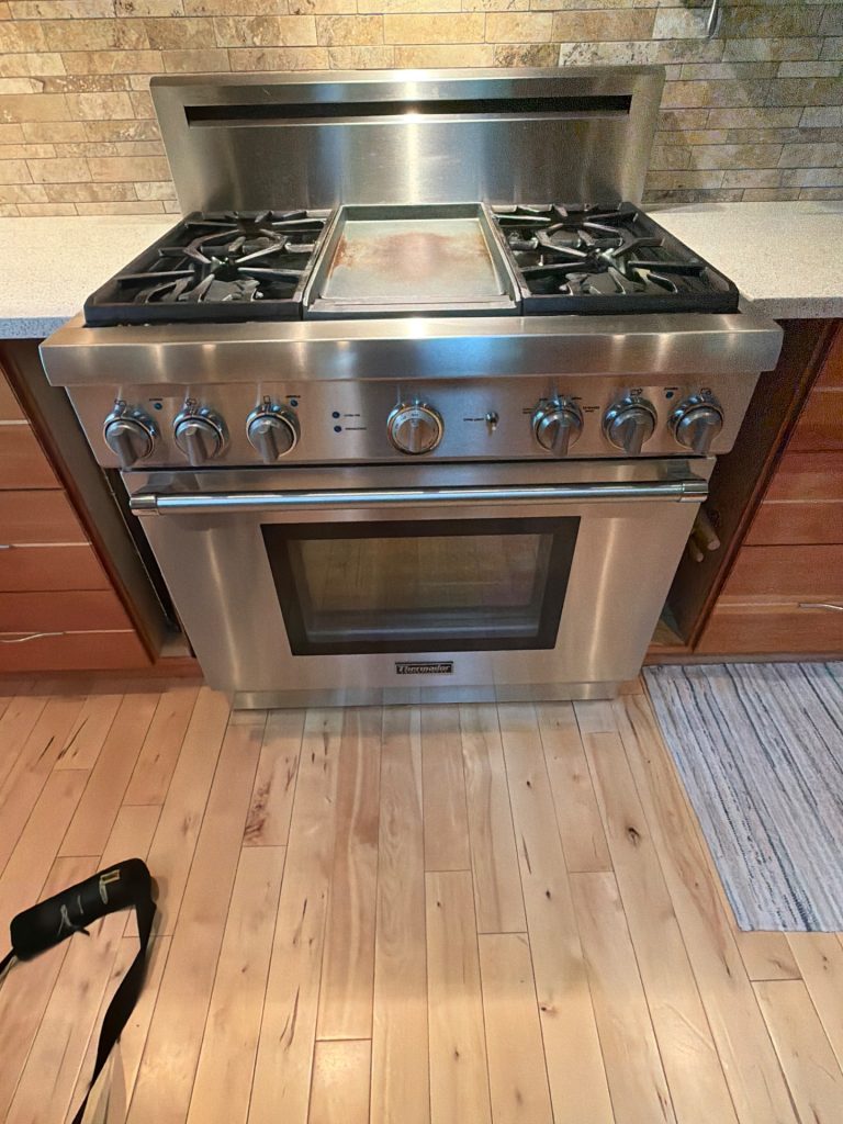 Thermador Pro Grand stainless steel gas range before bake ignitor repair in a Lac des Arcs Bow Valley kitchen