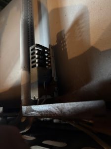 Close-up of the bake ignitor and burner assembly accessed inside a Thermador Pro Grand gas oven in Lac des Arcs