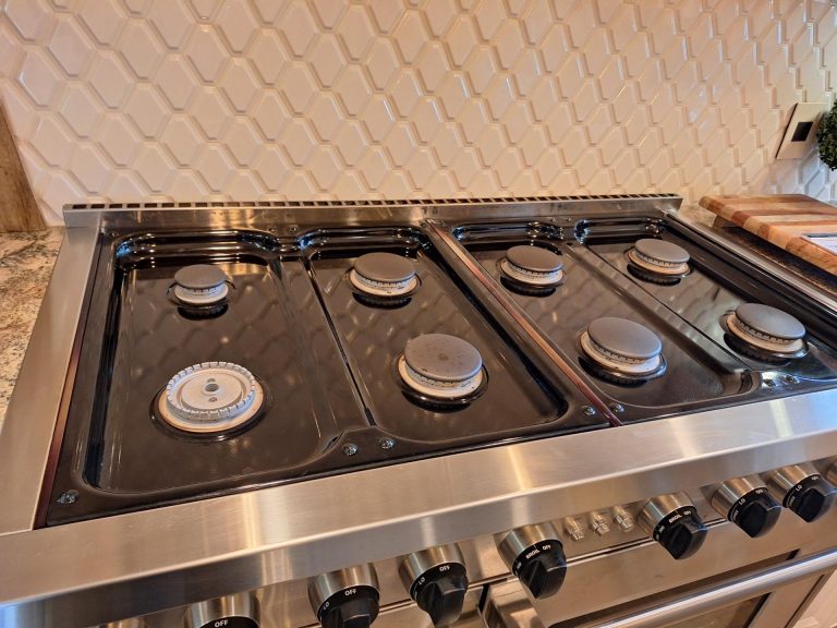 Spark module compartment access on the Wolf GR488 48-inch gas range during the diagnostic visit