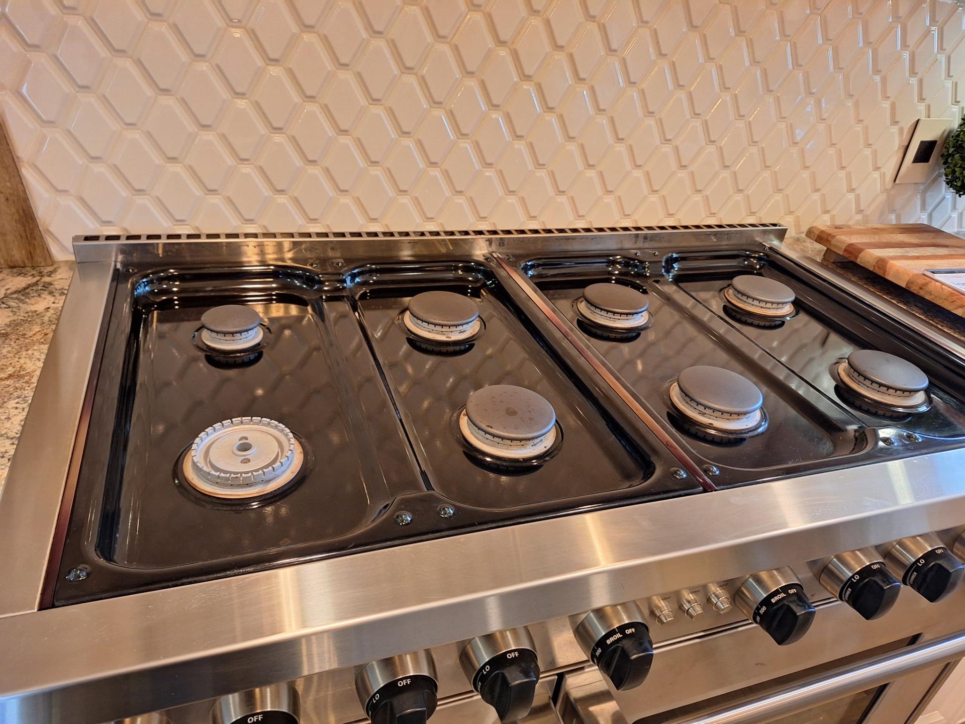 Spark module compartment access on the Wolf GR488 48-inch gas range during the diagnostic visit