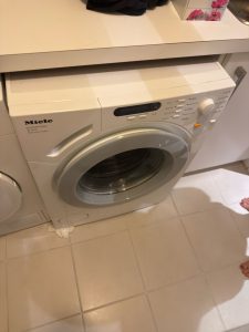 Miele W1612 front-load washer reassembled after the carbon brush replacement and door-seal component installation