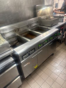 Frymaster commercial fryer battery in a downtown Vancouver restaurant kitchen before service