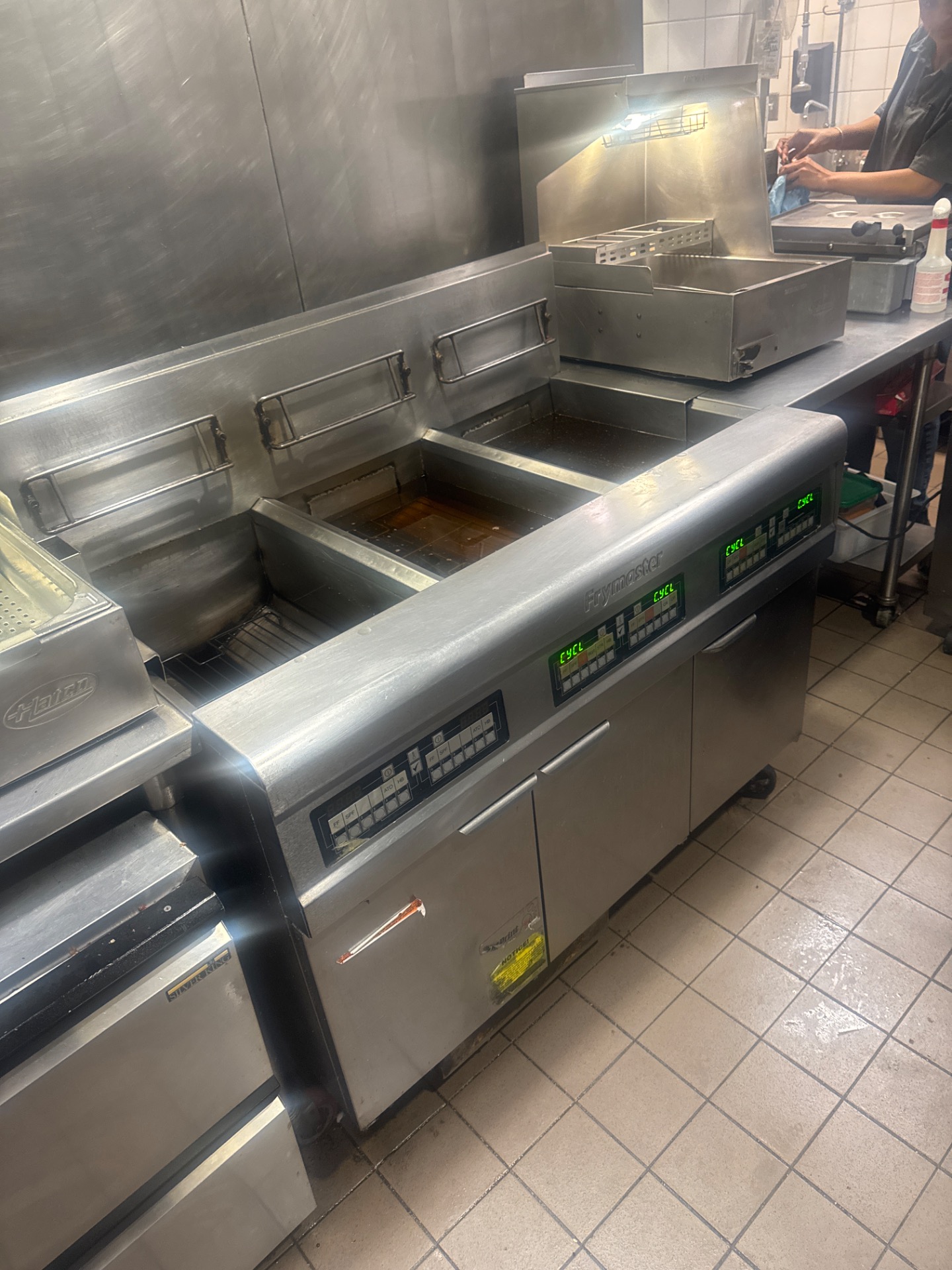 Frymaster commercial fryer battery in a downtown Vancouver restaurant kitchen before service