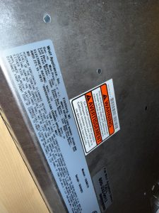 Close inspection of a Wolf gas cooktop burner during a no-ignition diagnostic visit