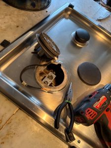 Failed Wolf spark module and cracked igniter on a single burner of the CG365T/S gas cooktop, identified after cleaning ruled out the other burners