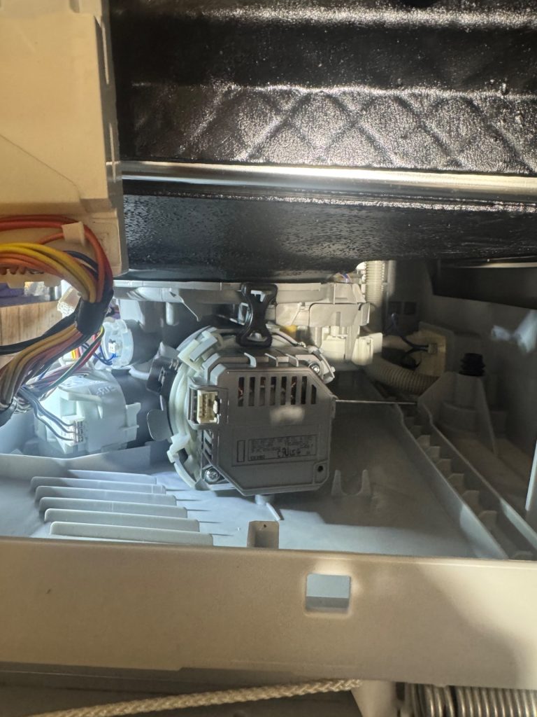 New Bosch OEM wash motor installed in the base of a built-in dishwasher during a Marlborough, Calgary repair