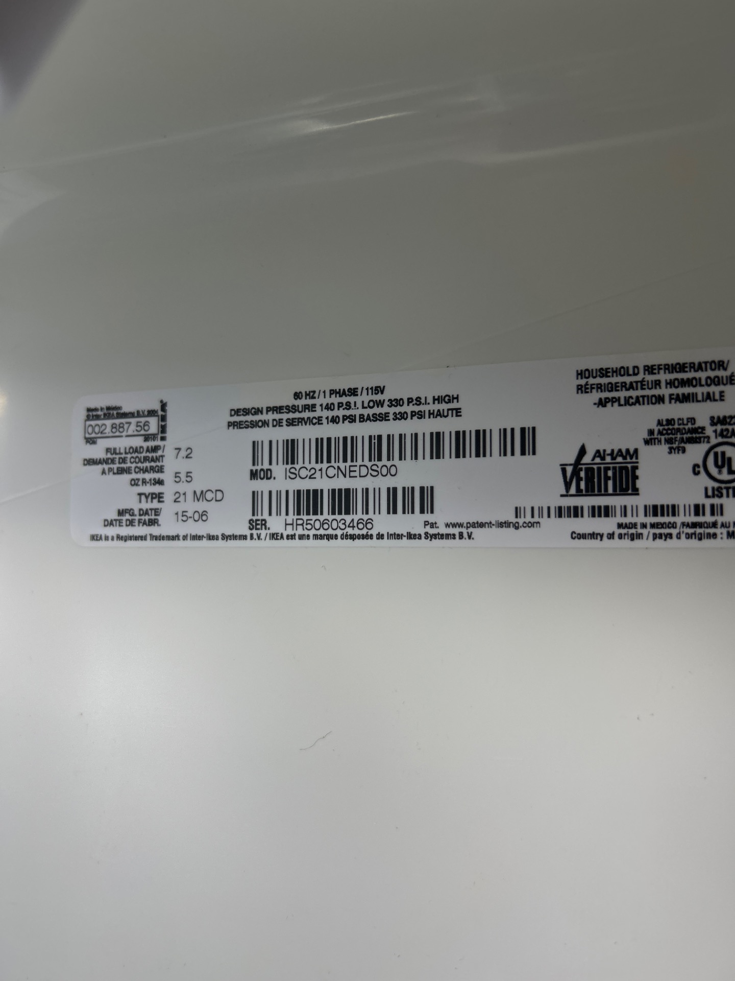 Whirlpool refrigerator data plate read during diagnosis in a Beltline condo, Calgary