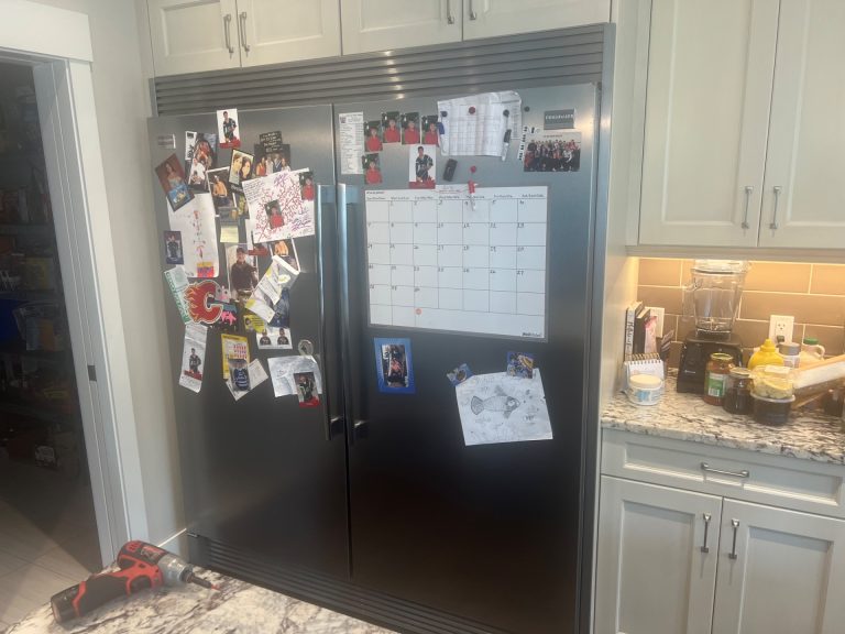 Restored Frigidaire FTRH19D7LF1 refrigerator back in service in an Aspen Woods, SW Calgary kitchen after a sealed-system rebuild