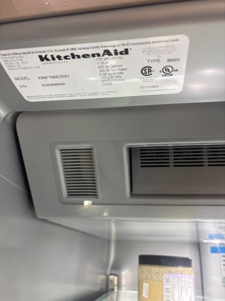 KitchenAid refrigerator interior control area and nameplate showing model KRMF706ESS01 in Eau Claire, Calgary