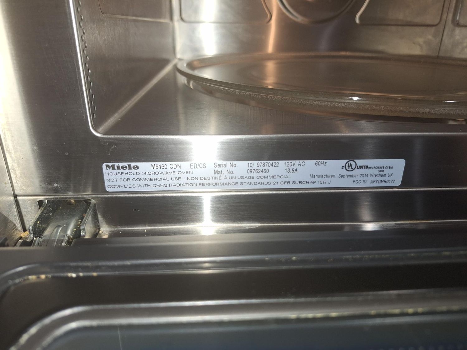 Miele M6160 CDN nameplate inside the microwave cavity confirming the model during diagnosis