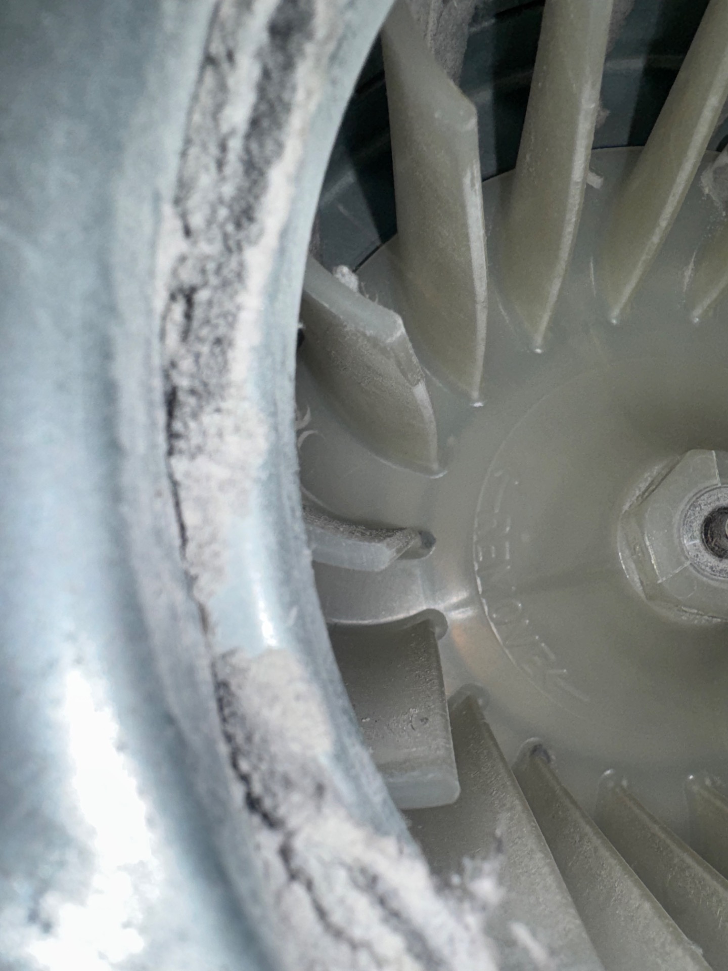 Worn Electrolux dryer drum blower and support surface caked with lint during a grinding-noise diagnosis in Cochrane, AB