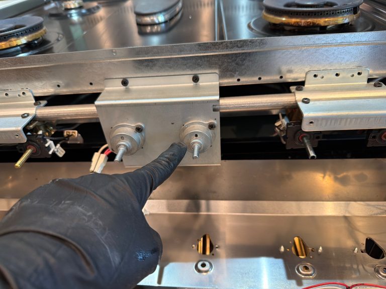 TechVill technician servicing the temperature control of a Blomberg oven in Edmonton