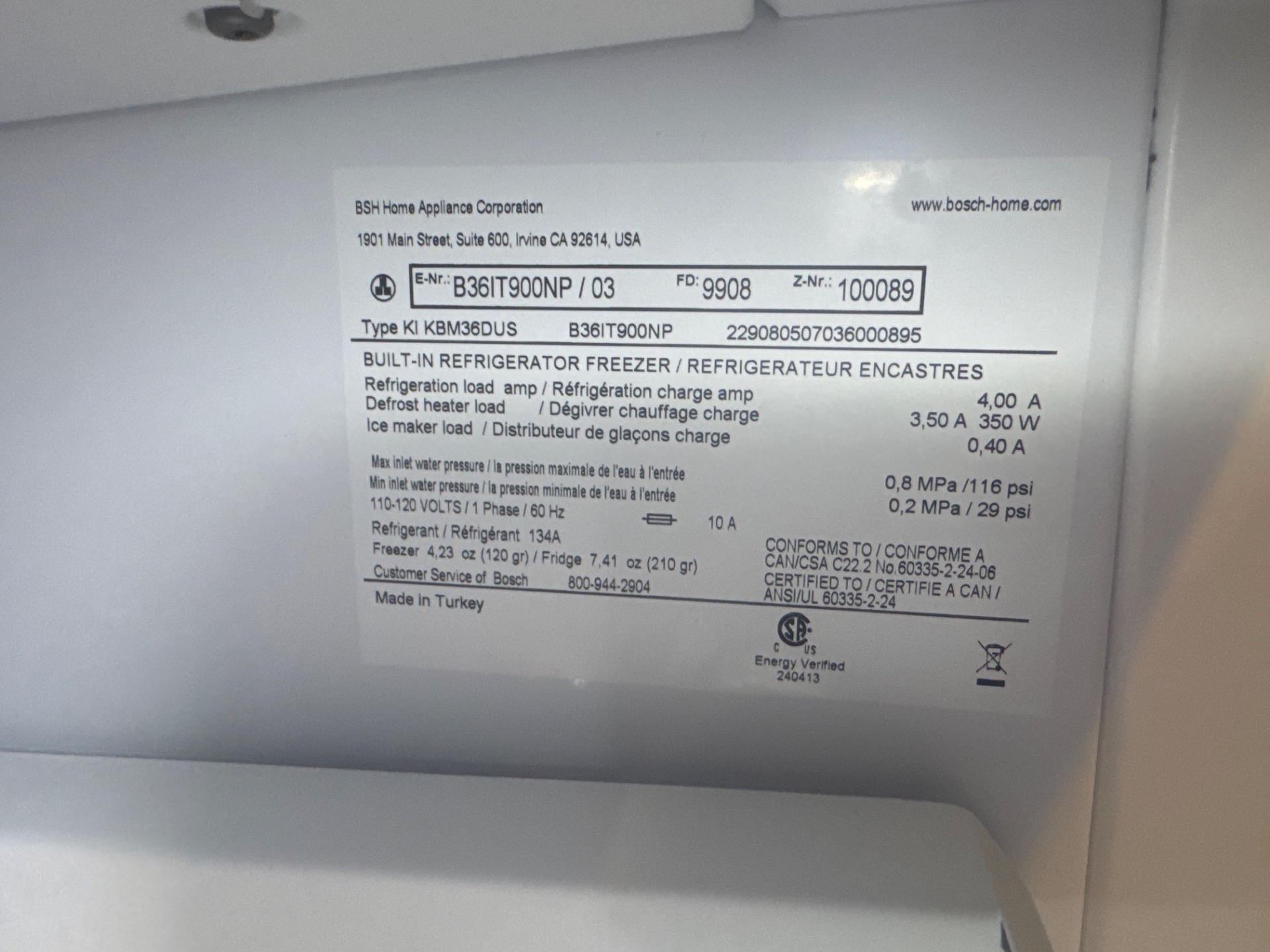 Bosch Benchmark B36IT900NP built-in refrigerator rating plate confirming model and R134a specification during a TechVill diagnosis in Central Lonsdale, North Vancouver