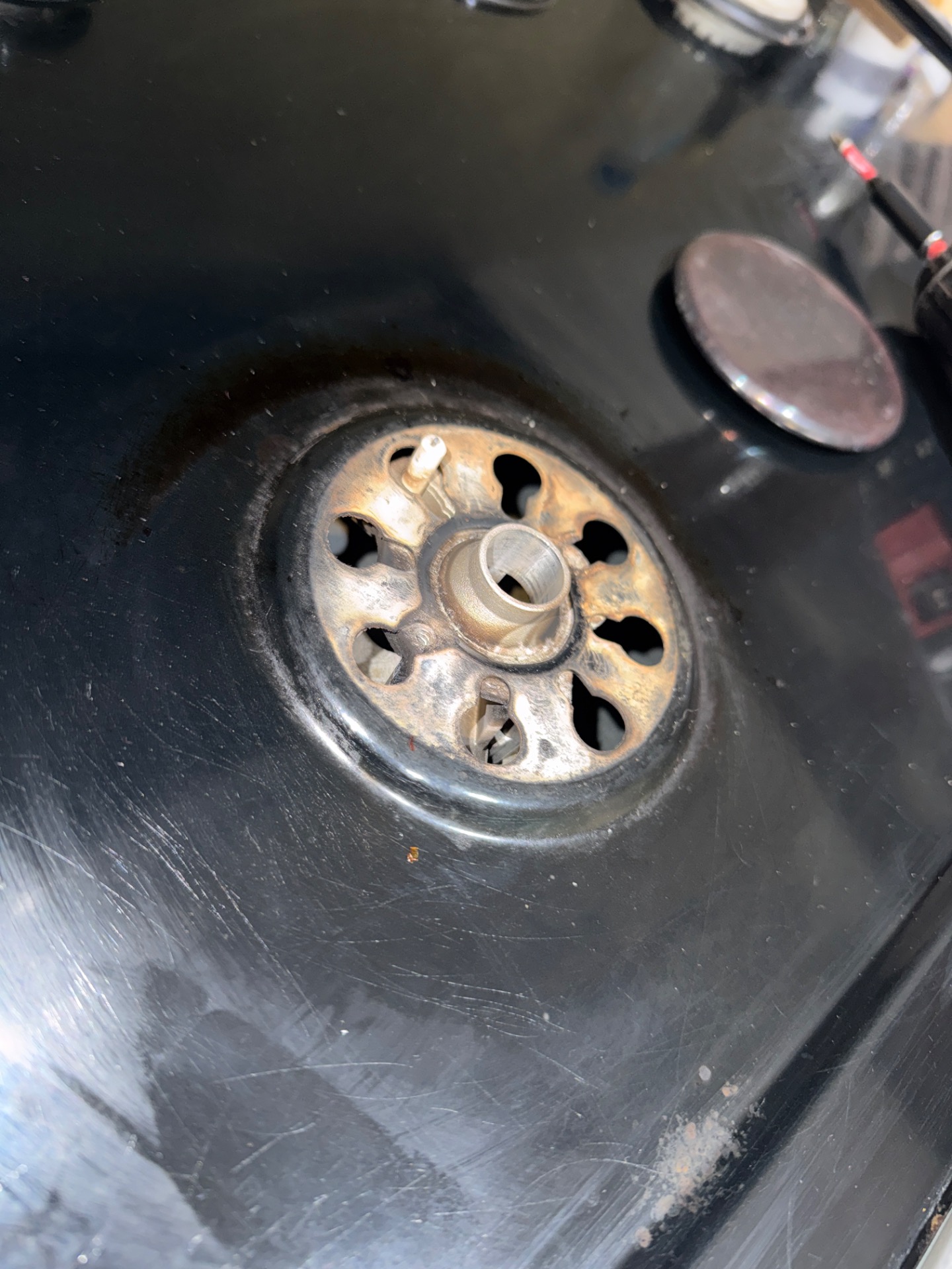 Cracked burner ignitor identified on a Maytag gas range during a North Vancouver service call