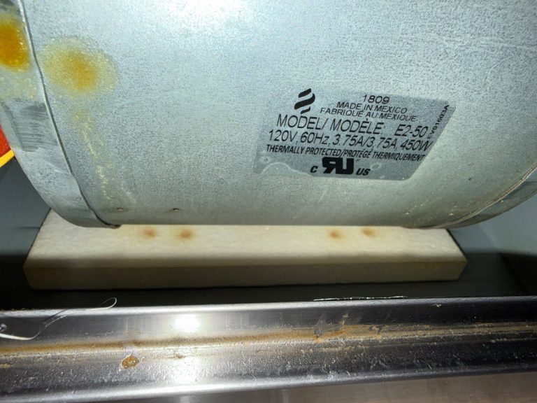 TechVill technician diagnosing a whistling Bosch range hood in Barrhaven Ottawa