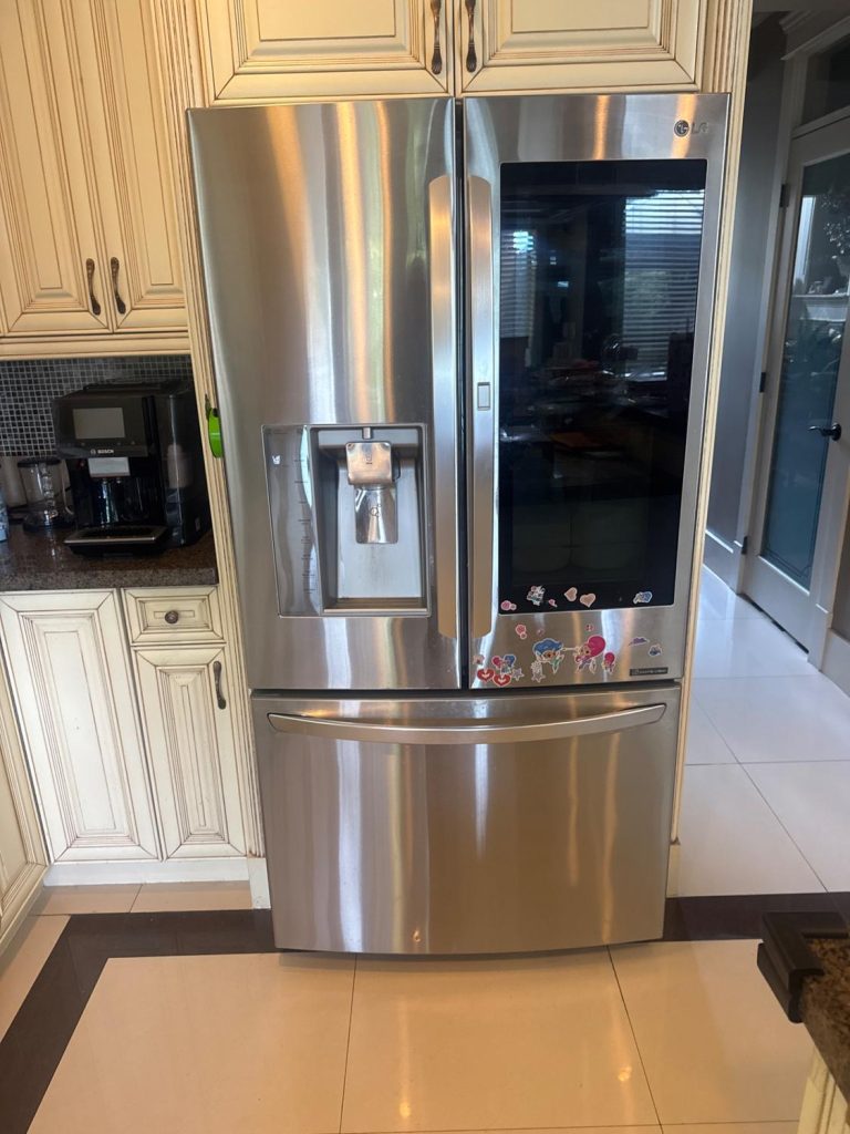LG LFXS30796S French-door refrigerator with door-mounted water dispenser in a Terra Nova, Richmond kitchen