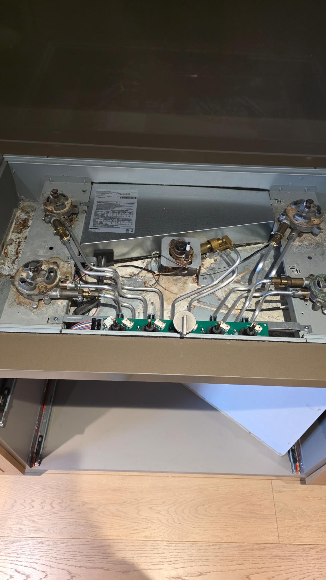 Control PC board access on a Gaggenau Vario gas cooktop during a Vancouver repair