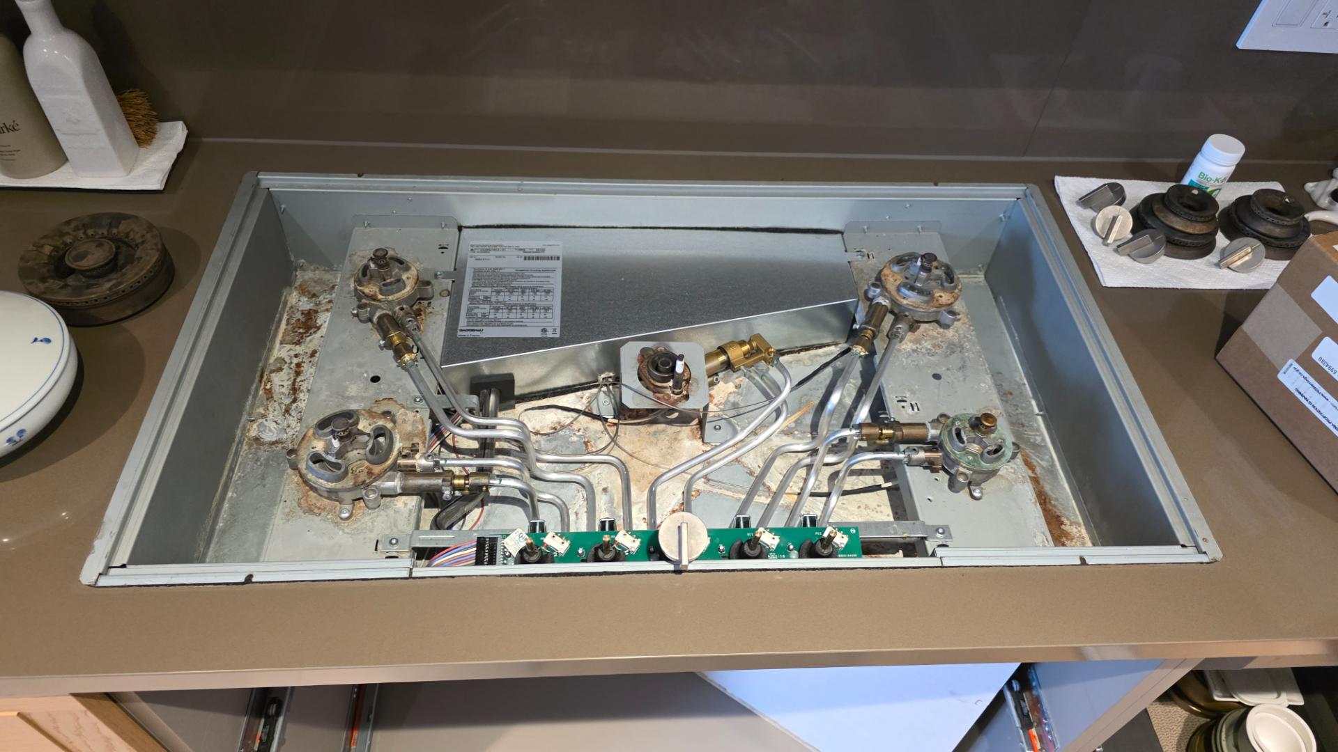 TechVill technician diagnosing a Gaggenau Vario gas cooktop that won't ignite in Marpole Vancouver