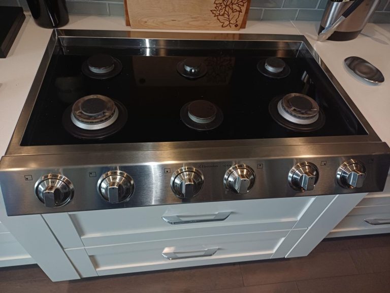Electrolux ICON 36-inch gas cooktop with all six burners reassembled after TechVill ignition service in Calgary