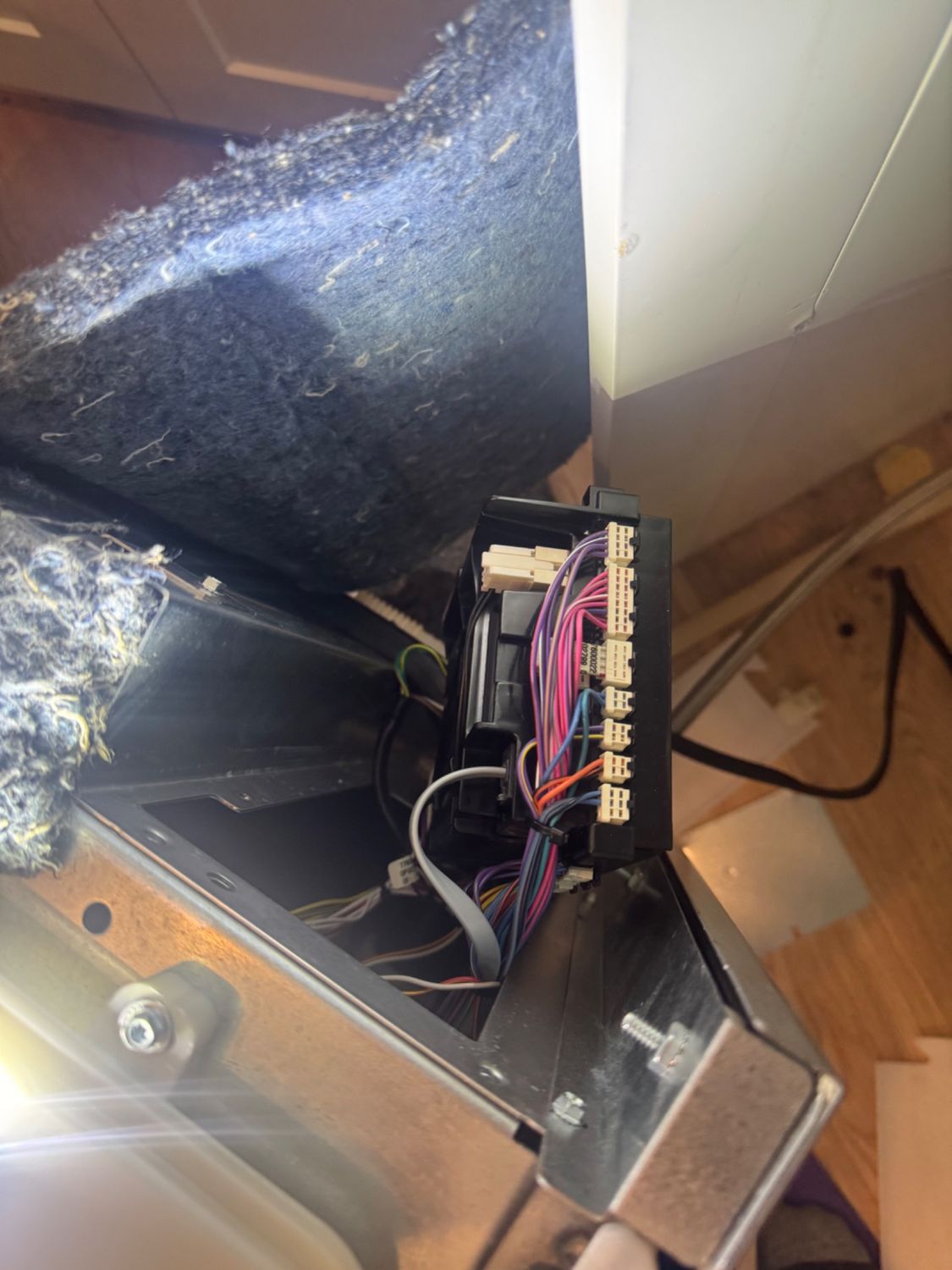 Removed Cove main control board with its wiring connectors during the component replacement