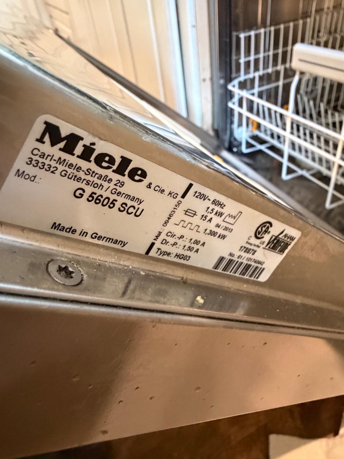 Miele G 5605 SCU model plate on the dishwasher door frame, made in Germany