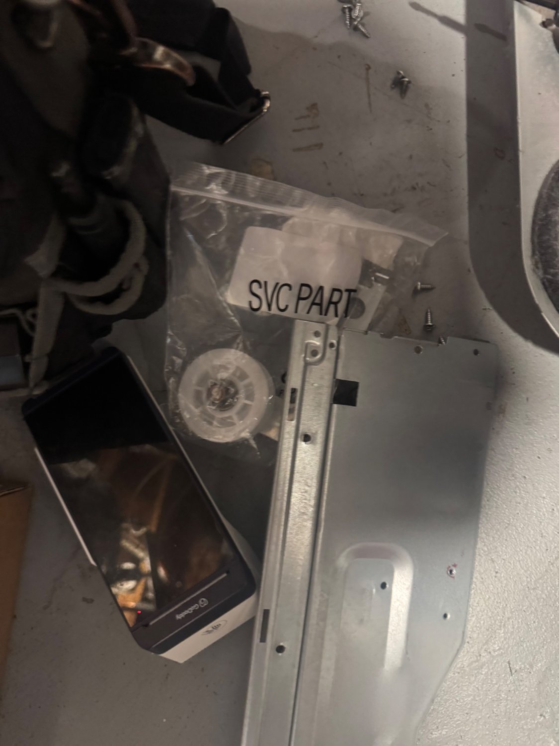 LG OEM service part bag with the replacement idler pulley during the dryer repair in Brentwood