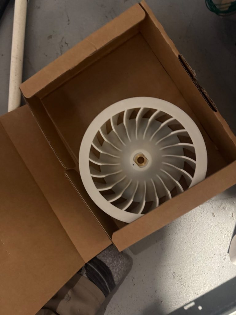 New LG dryer blower wheel in its parts box before installation at a Brentwood, Calgary home