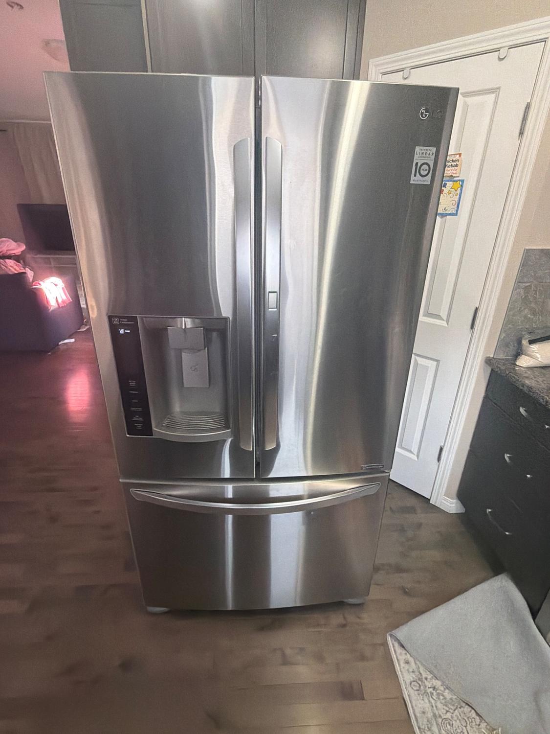 LG French-door refrigerator with bottom freezer in a Nolan Hill, NW Calgary kitchen before TechVill diagnosis